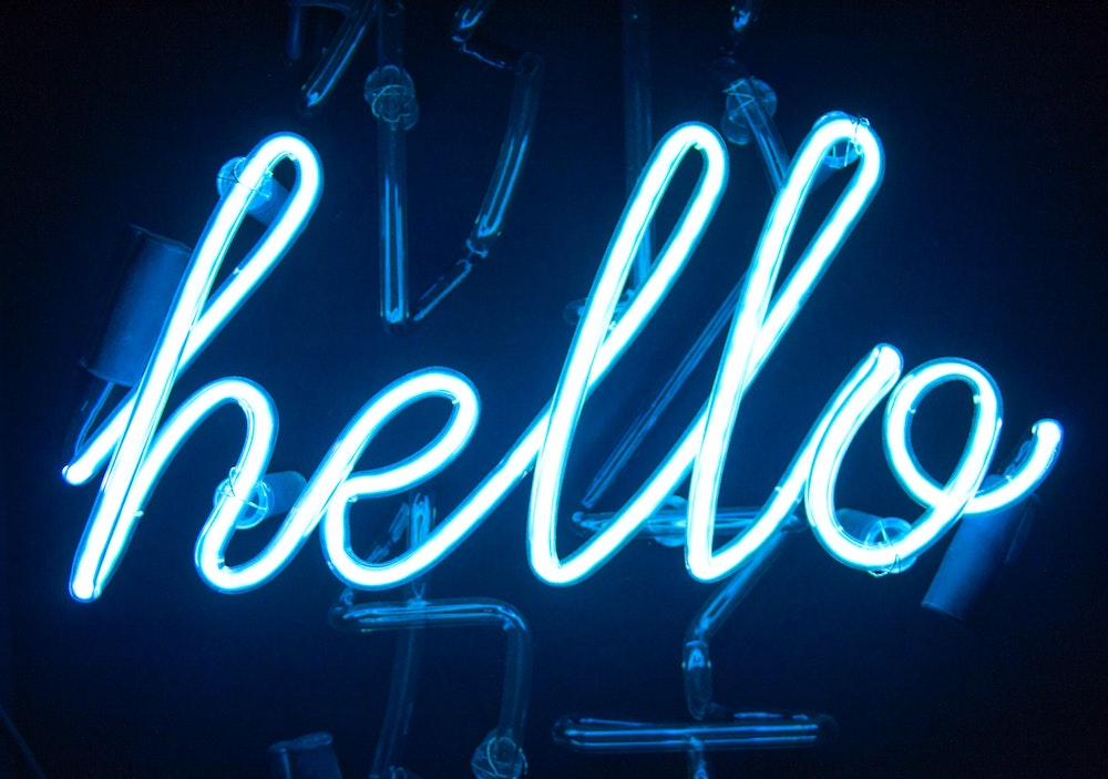 A neon glowing hello sign