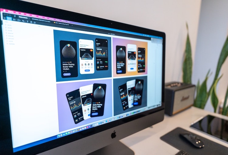App design mockups on a computer screen